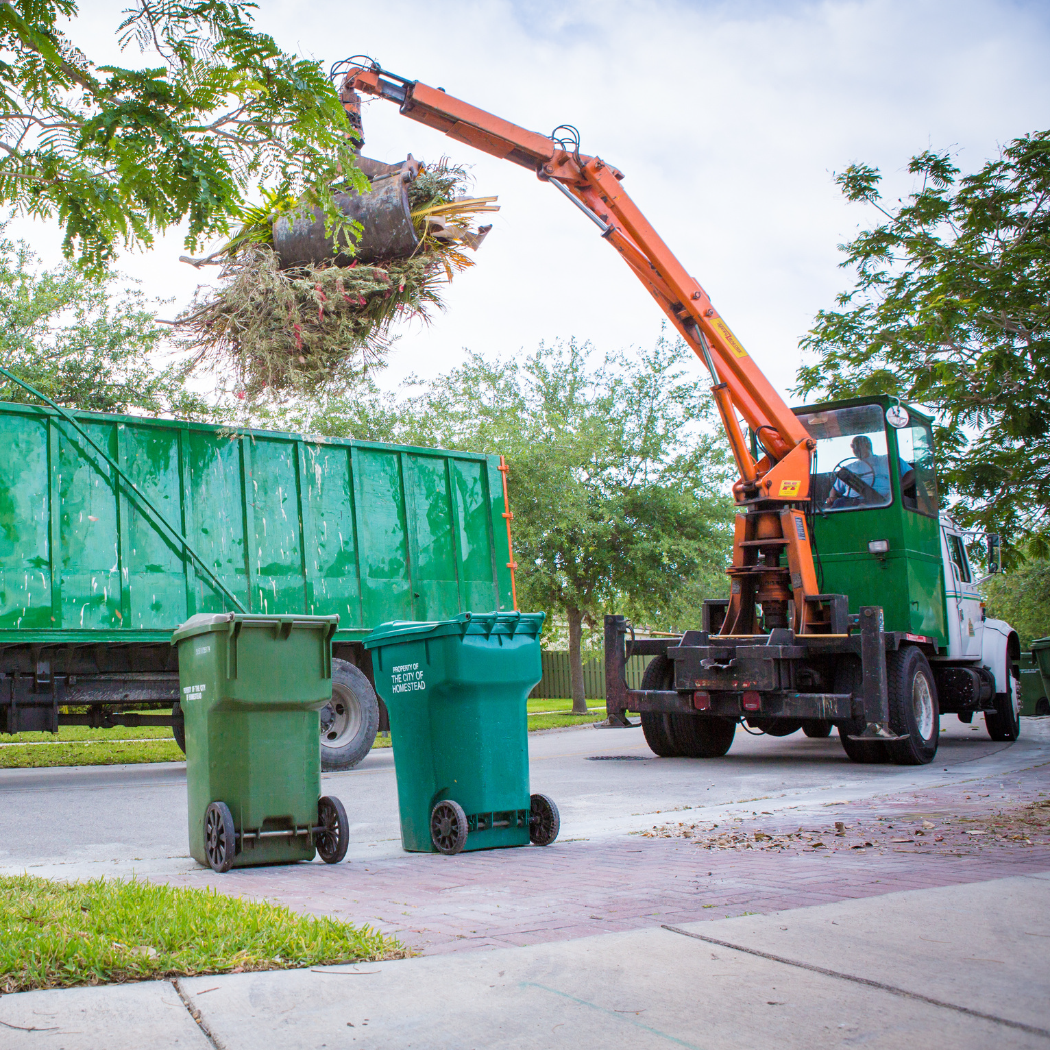 HPS Truck picking up bulk garbage 