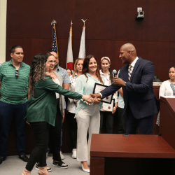 Man shaking woman's hand